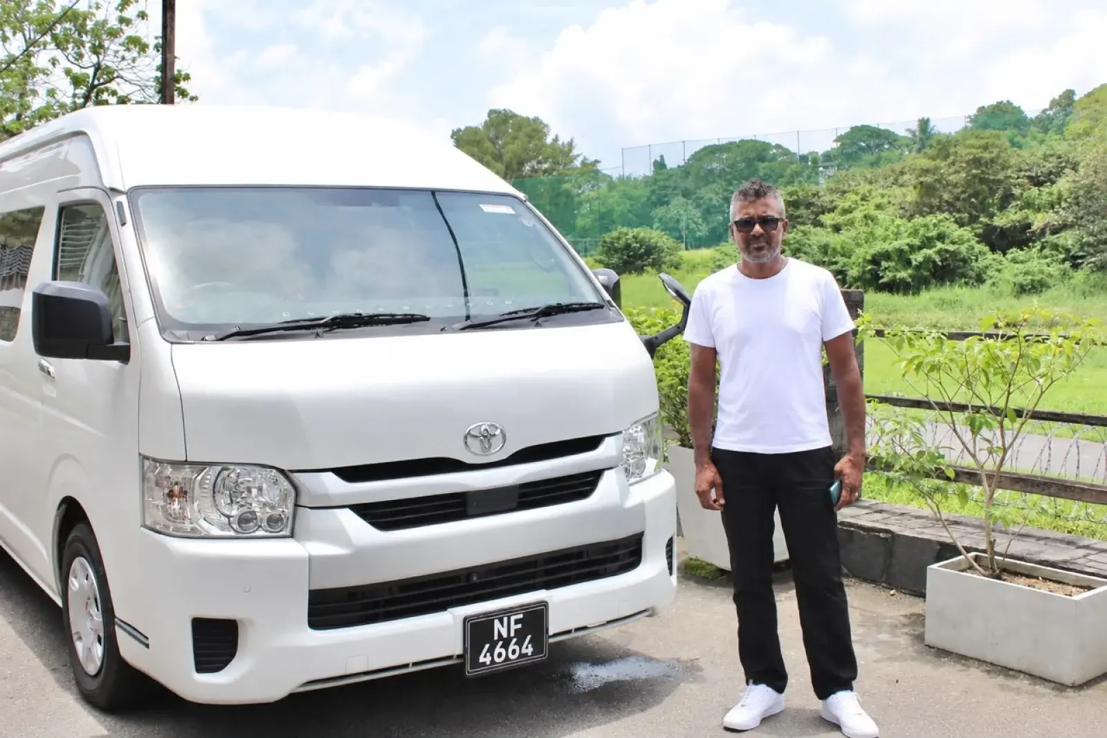 Silver Toyota High Roof Van - Sisira Mathgaweera